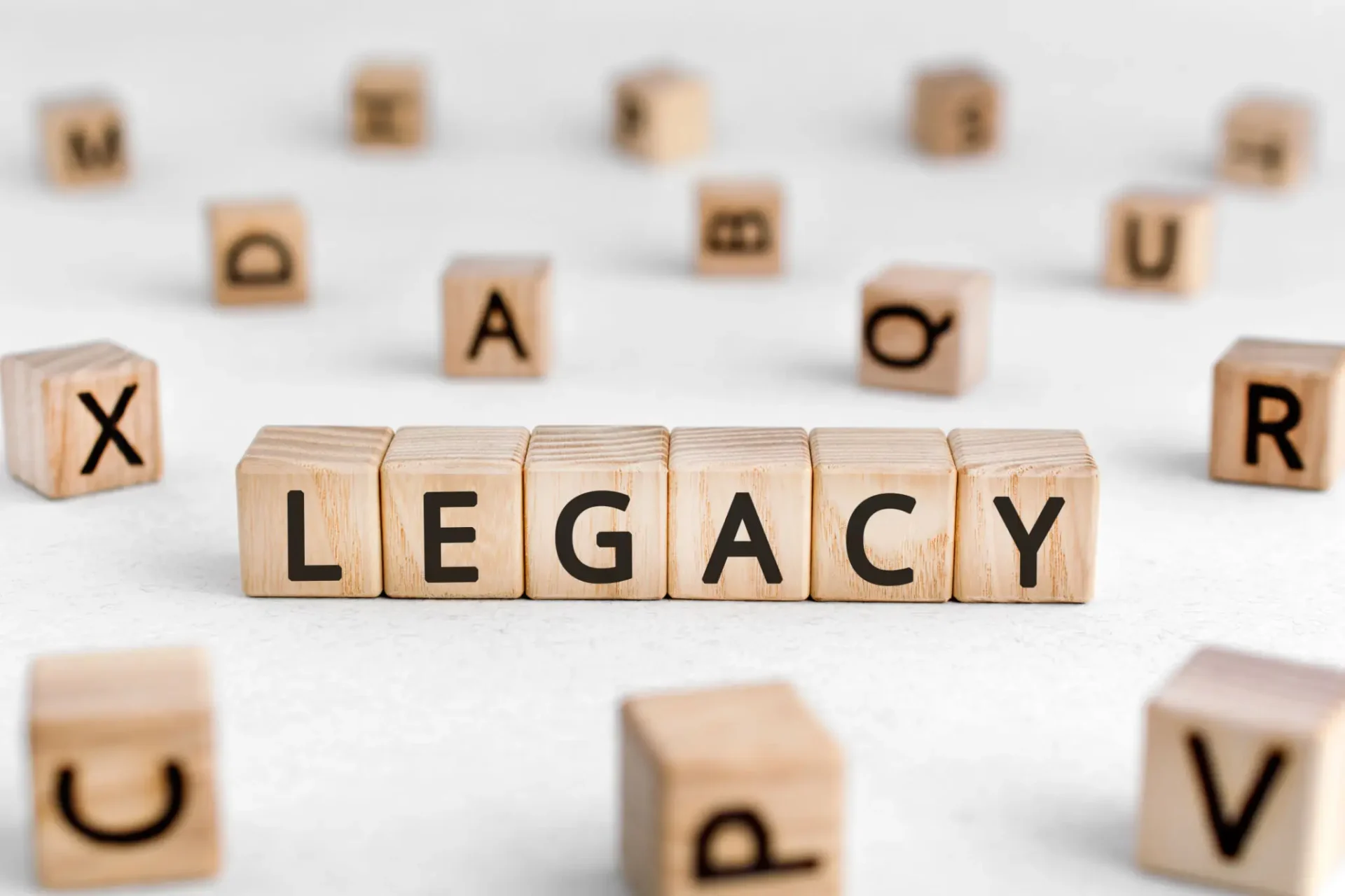 Wooden blocks spelling out the word 'LEGACY'.